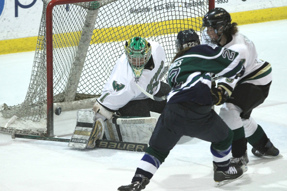 Ethan Magoc photo: Mercyhurst College junior Jess Jones shoots against Wayne State goaltender Delayne Brian during the first period on Saturday, Feb. 5, 2011, at the Mercyhurst Ice Center.